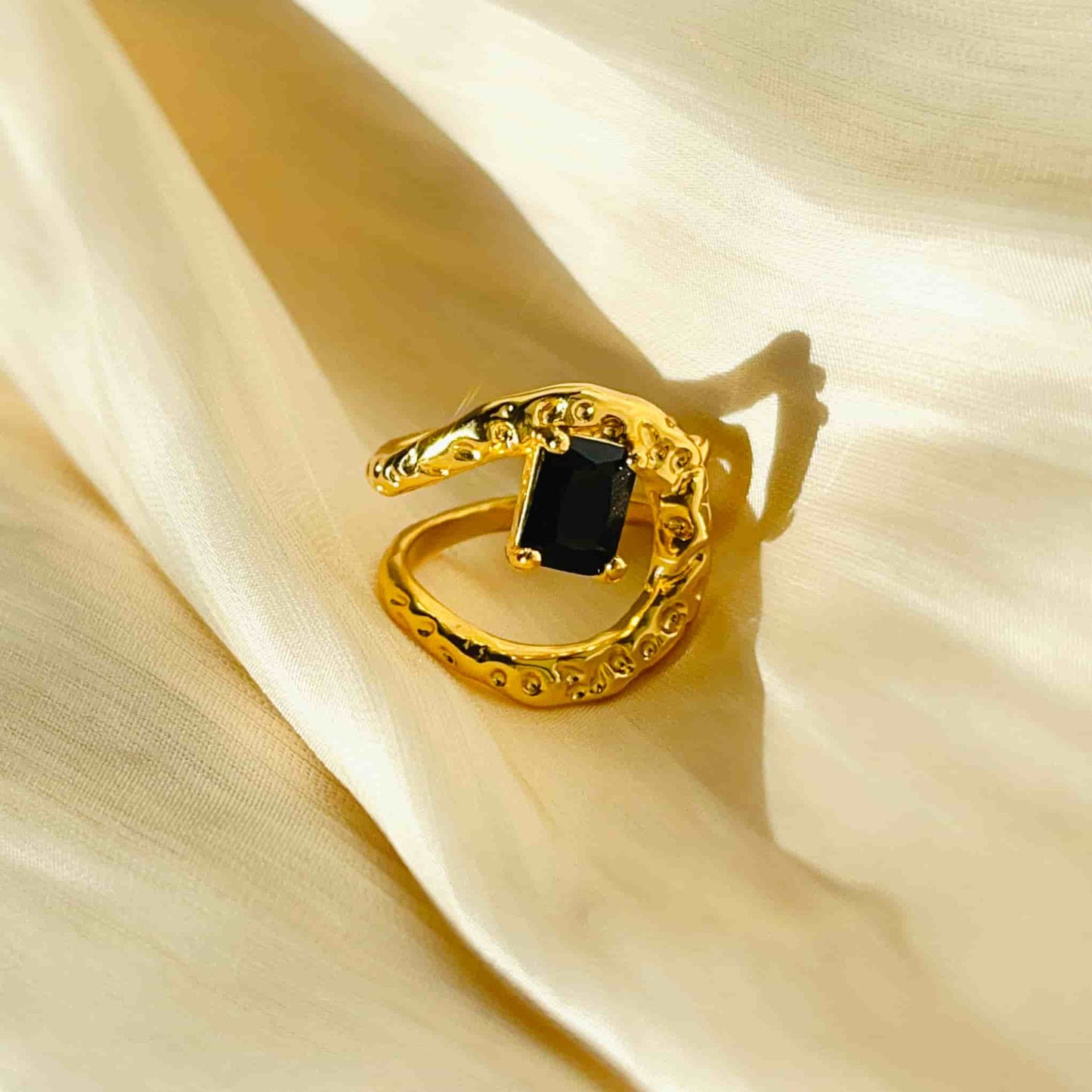 Classic Black and Gold Combination, Absolutely Stunning. Material: Obsidian and copper plated with 18K gold. Weight: 6g Dimensions: approximately #7 (adjustable