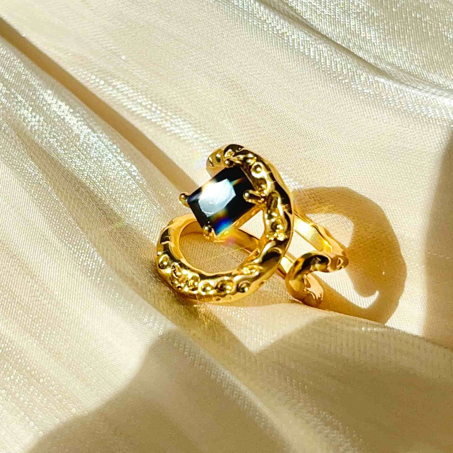 Classic Black and Gold Combination, Absolutely Stunning. Material: Obsidian and copper plated with 18K gold. Weight: 6g Dimensions: approximately #7 (adjustable