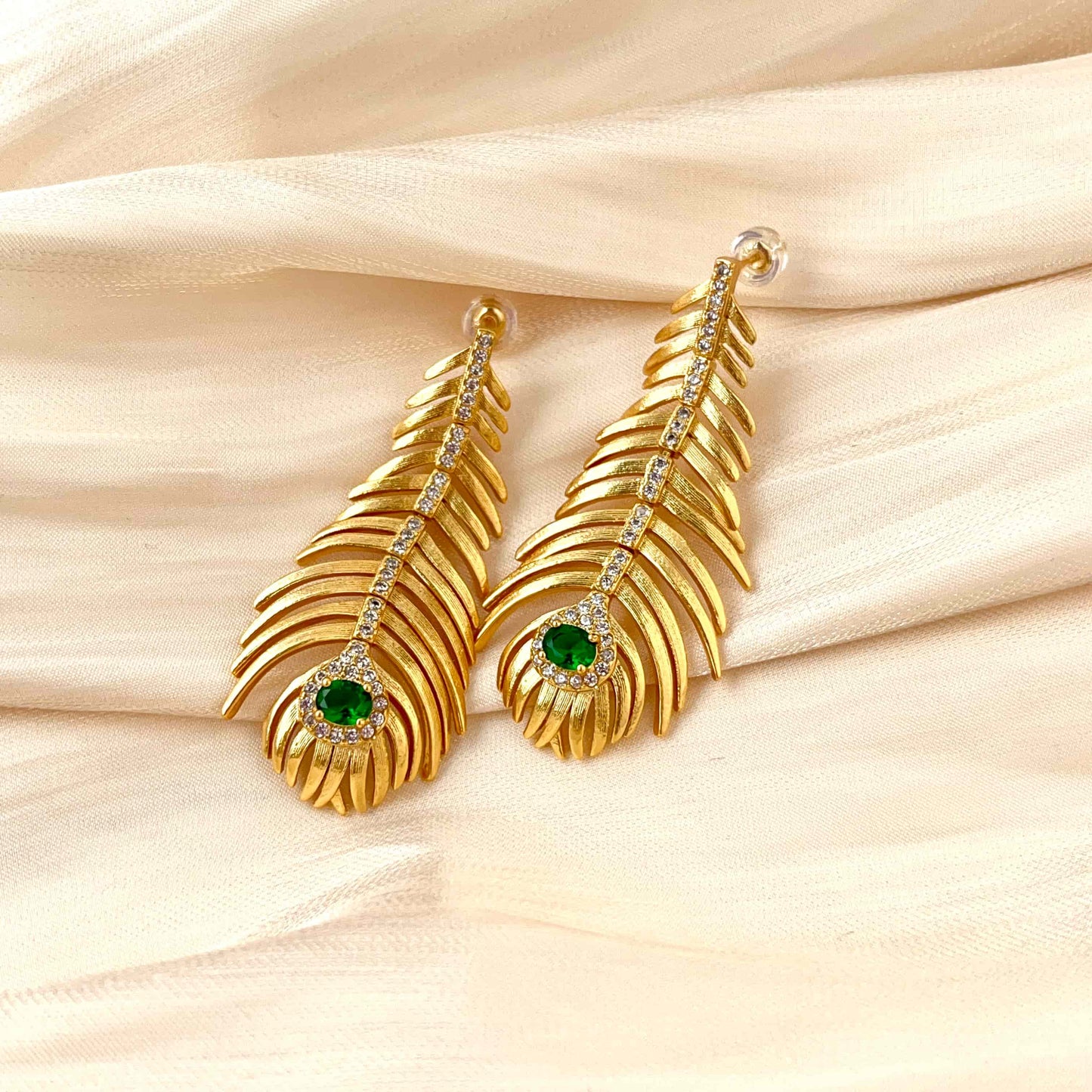 Classical Gold Peacock Feather-Shaped Earrings Inlaid with Green Zirconia. Material: S925 silver pins, Zircon and copper plated with 18K gold. Weight: 10.3g/pair Dimensions:5.1cm*2.3cm