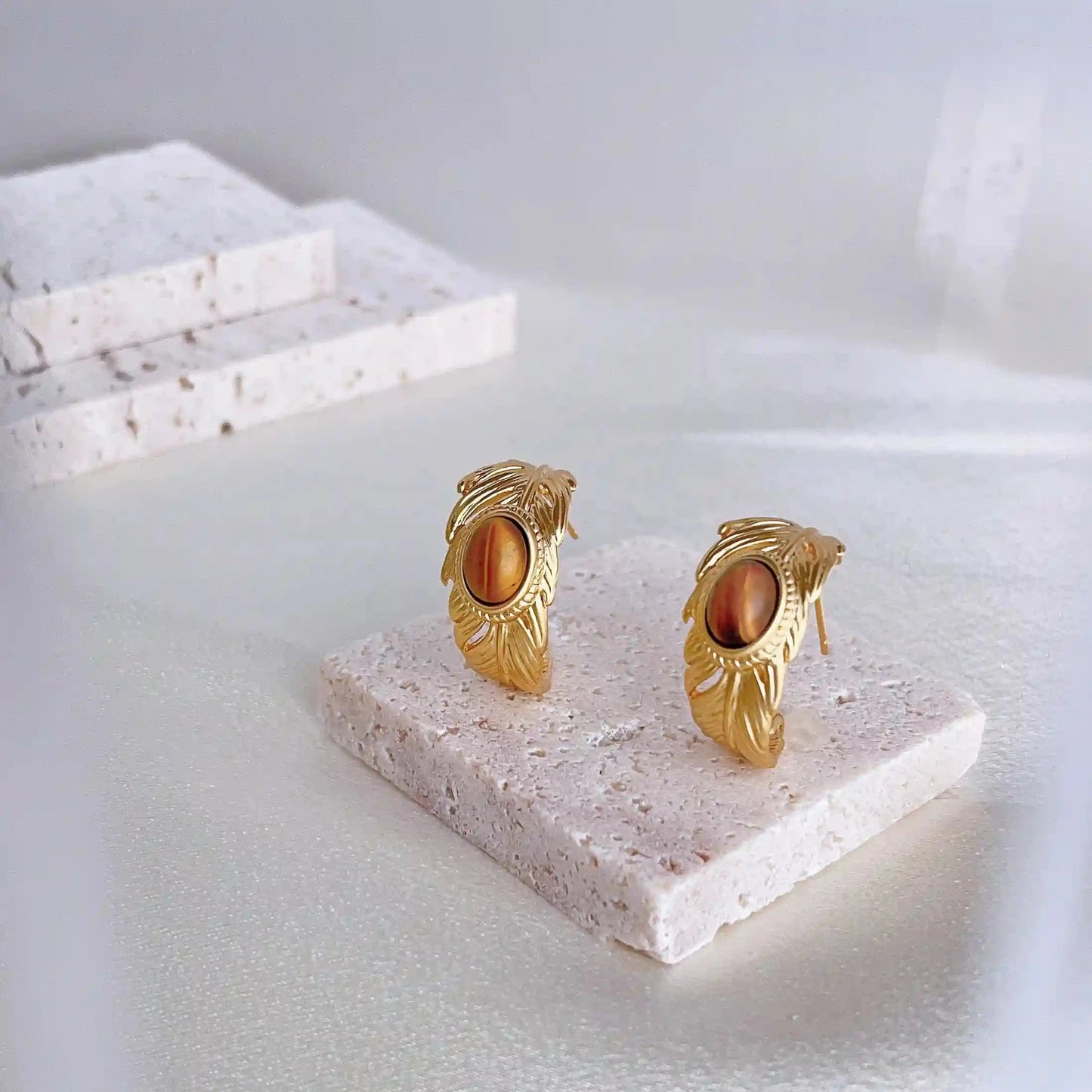 A Feng Shui Tiger-eye stone jewelry for you. The tiger-eye is known as the stone of self-confidence! Material: S925 silver pins, tigerite and copper plated with 18K gold. Weight: 9.1g/pair Dimensions:2.2cm*1.2cm