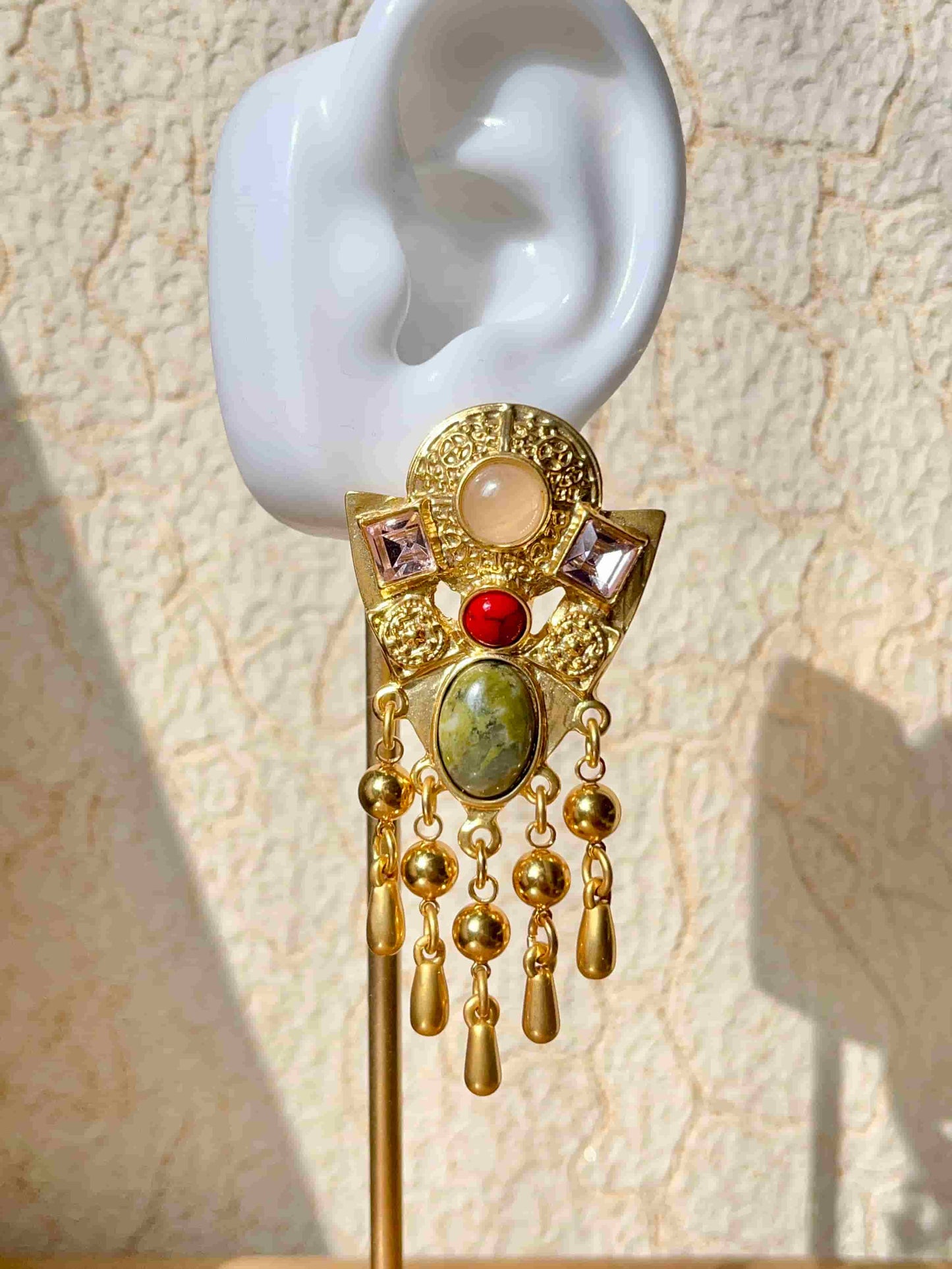 Exquisite Gold Clip-on Pendant Earrings adorned with Unakite, Zircon and natural stone. Material:Copper plated with 18K gold, Unakite, natural stone, Zircon Weight:37.4g / pair Dimensions:7cm*3.2c