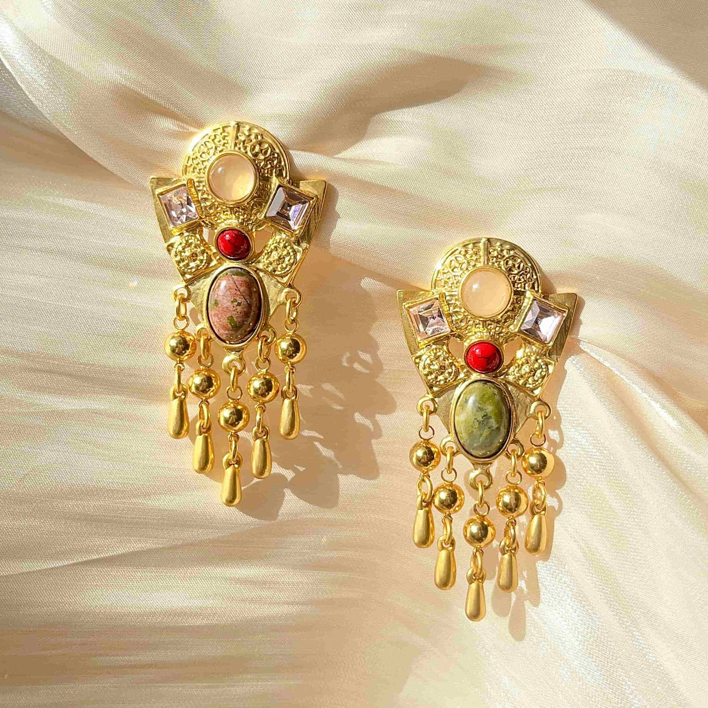Exquisite Gold Clip-on Pendant Earrings adorned with Unakite, Zircon and natural stone. Material:Copper plated with 18K gold, Unakite, natural stone, Zircon Weight:37.4g / pair Dimensions:7cm*3.2c