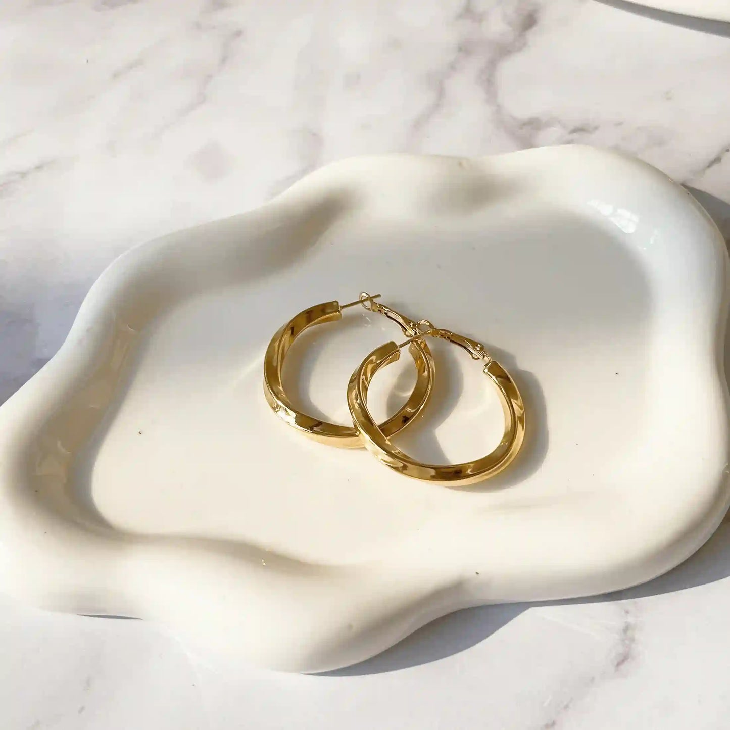 Gold Möbius Loop Earrings. Utilizing hollow technology to make the earrings lighter. 18k Gold Plated, Stainless Steel, Hypoallergenic Material, Waterproof, Tarnish Free