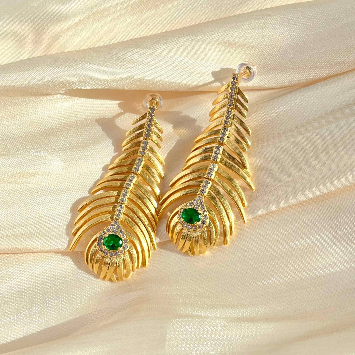 Classical Gold Peacock Feather-Shaped Earrings Inlaid with Green Zirconia.  Material: S925 silver pins, Zircon and copper plated with 18K gold. Weight: 10.3g/pair Dimensions：5.1cm*2.3cm