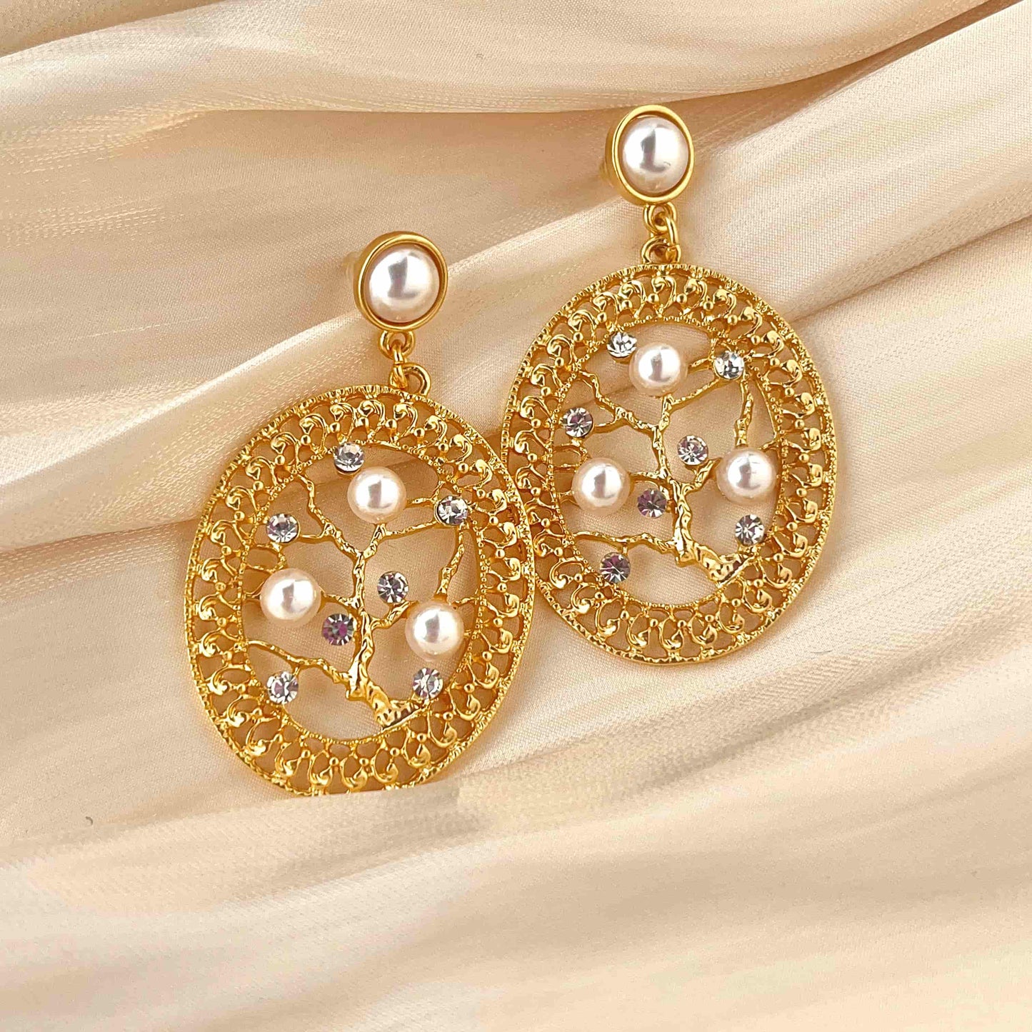 Unique Oval Filigree Branch Earrings, Adorned with Zirconia and Mother of Pearl  Material：S925 silver pins copper plated with 18K gold, Mother of pearl, Zircon Weight：13.1g / pair Dimensions：6cm*3.5cm