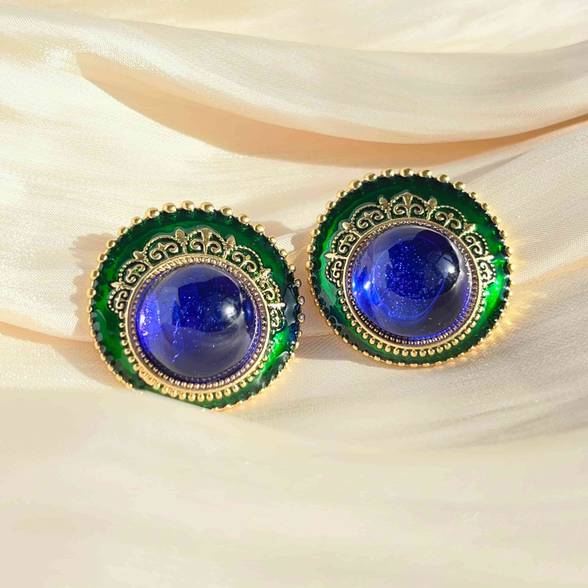 Gemstone Blue Glass and Green Dripped Glaze Vintage Earrings with a Classical Touch.  Material: S925 silver pins, Dripped Glaze, stained glass and copper plated with 18K gold. Weight: 17.7g/pair Dimensions：3cm*2.9cm