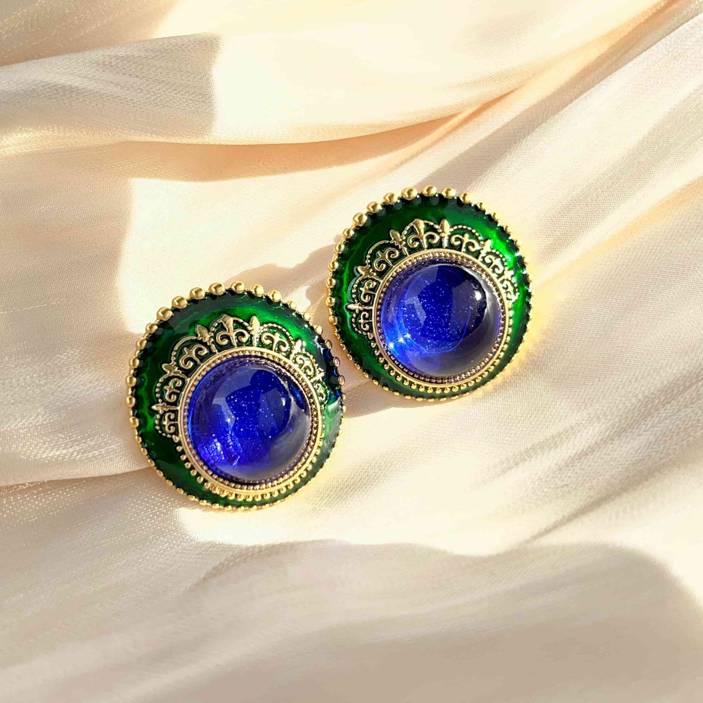 Gemstone Blue Glass and Green Dripped Glaze Vintage Earrings with a Classical Touch.  Material: S925 silver pins, Dripped Glaze, stained glass and copper plated with 18K gold. Weight: 17.7g/pair Dimensions：3cm*2.9cm