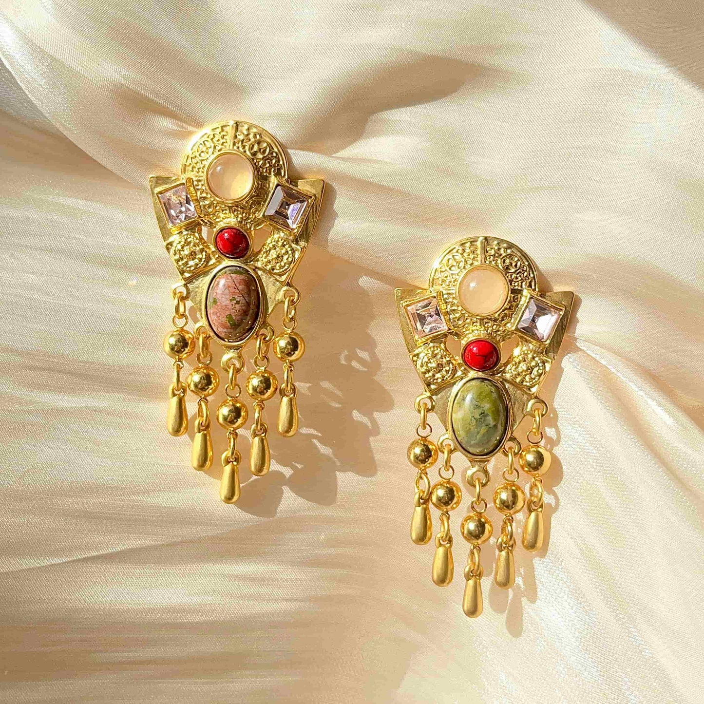 Exquisite Gold Clip-on Pendant Earrings adorned with Unakite, Zircon and natural stone.  Material：Copper plated with 18K gold, Unakite, natural stone, Zircon Weight：37.4g / pair Dimensions：7cm*3.2c