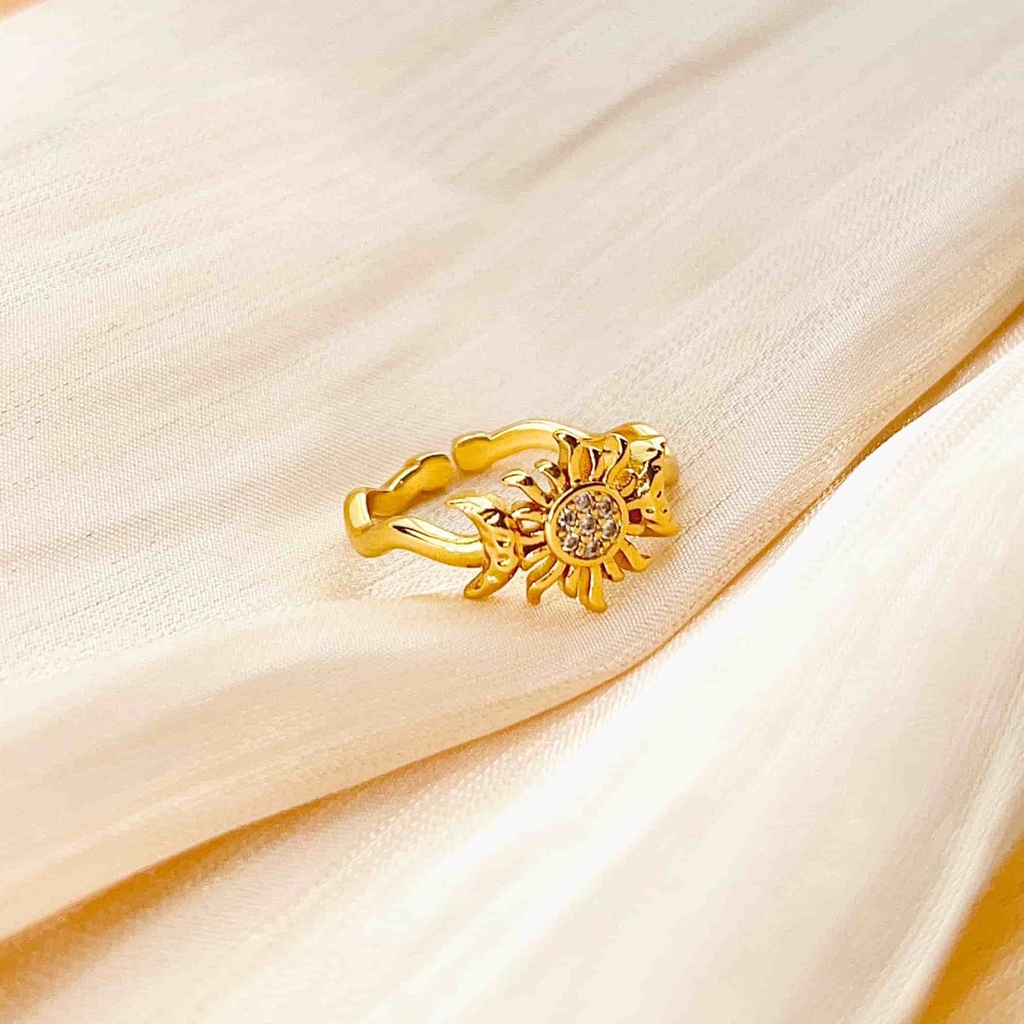 Simple and Sparkling Sun and Moon Ring Inlaid with Zirconia.  Material: Zircon and copper plated with 14K gold. Weight: 2.1g Dimensions: approximately #7 (adjustabl